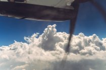 Clouds and blue sky from airscrew airplane — Stock Photo