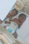 CAMEROON - AFRICA - APRIL 5, 2018: newborn little children lying in sterile box — Stock Photo