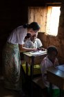 ANGOLA - AFRICA - APRIL 5, 2018 - Teacher and pupils studying in class — Stock Photo