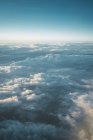 View of white clouds in blue sky from above — Stock Photo