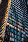 Close-up of illuminated tall office tower in evening — Stock Photo