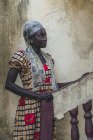 CAMEROON - AFRICA - APRIL 5, 2018: Thoughtful young ethnic woman standing at stairs and looking away — Stock Photo