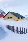 Small colorful houses and wooden fence in winter, Valle De Tena, Spain — Stock Photo