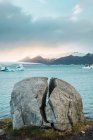 Rock formation on coast and glaciers in cold sea, Iceland — Stock Photo