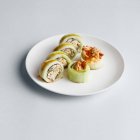 Sushi roll wrapped in cucumber — Stock Photo