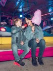 Mother and son with snacks on funfair — Stock Photo