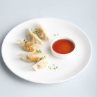 Japanese traditional dumplings with sauce — Stock Photo