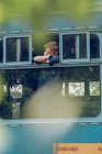 Little boy standing inside of old train — Stock Photo