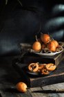Fresh loquats on plates — Stock Photo