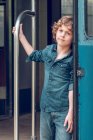 Boy standing at train wagon — Stock Photo