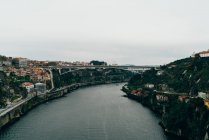 Bridge over river and city with orange roofs, Porto, Portugal — Stock Photo