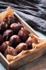 Fresh ripe figs in wooden box — Stock Photo