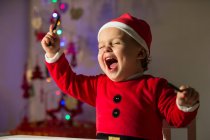 Happy little boy in Christmas clothes — Stock Photo