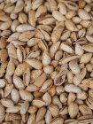 Close-up of shelled dried almonds in heap — Stock Photo