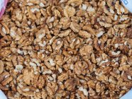 Close-up of peeled raw walnuts in heap — Stock Photo
