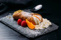 Breakfast dessert with whipped cream on slate — Stock Photo