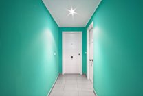 Interior of modern mint corridor with white doors — Stock Photo