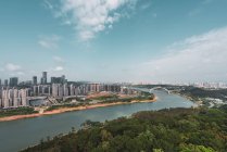 Cityscape of contemporary metropolis on river shore, Nanning, China — Stock Photo