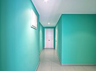 Interior of modern mint corridor with white doors — Stock Photo