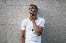 African man in white shirt posing. — Stock Photo