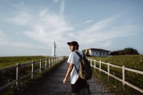 Man on footpath near lighthouse — Stock Photo