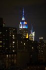 Illuminated empire state building at night, New York, USA — Stock Photo