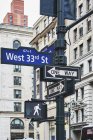 Traffic light and signs on signpost, New York, USA — Stock Photo