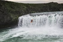 Person in kayak on water of mountain river, Iceland — Stock Photo
