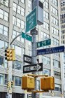 Signpost and traffic lights in downtown, New York, USA — Stock Photo
