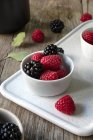 Blackberries and raspberries in a bowl — Stock Photo