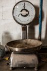 Crop view of older weighing machine standing in metal casting factory — Stock Photo