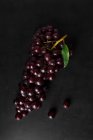From above bunch of fresh red grapes on dark background. — Stock Photo