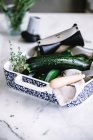 Ingredients for zucchini salad in patterned dish — Stock Photo