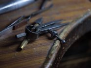 Close-up of different metal tools on wooden table — Stock Photo