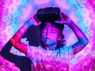 Focused boy with VR glasses under projection — Stock Photo