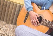 View of woman playing guitar — Stock Photo