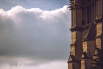 Wall of Notre Dame de Paris on background of cloudy sky, Paris, France — Stock Photo