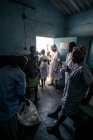 ANGOLA - AFRICA - APRIL 5, 2018 - African women with children walking out of the hospital. — Stock Photo