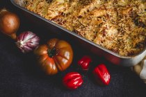 Baked macaroni with cheese and chorizo in baking pan — Stock Photo