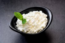 Fresh cottage cheese in a metal bowl — Stock Photo