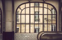 Big window from inside building with view on facade of house — Stock Photo