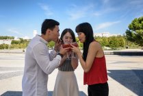 Asian people drinking yummy beverage — Stock Photo