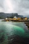 Picturesque aerial view of small village on rocky shore — Stock Photo