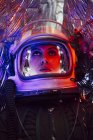 Close-up of female astronaut wearing old space helmet — Stock Photo