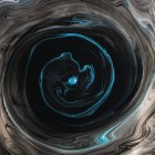 Swirls of dissolving blue and black paint — Stock Photo
