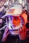 Close-up of female astronaut wearing old space helmet — Stock Photo
