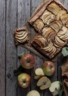 Homemade apple pie on shabby wooden table — Stock Photo