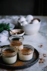 Jars with custard and chocolate desert — Stock Photo