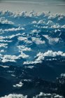 View on mountain and clouds from plane — Stock Photo
