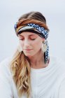 Beautiful woman with kerchief on head looking at camera — Stock Photo